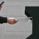 PHILADELPHIA, PA - OCTOBER 27: A man photographs himself depositing his ballot in an official ballot drop box while a long line of voters queue outside of Philadelphia City Hall at the satellite polling station on October 27, 2020, in Philadelphia, Pennsylvania. With the election only a week away, this new form of in-person voting by using mail ballots has enabled tens of millions of voters to cast their ballots before the general election. Vying to recapture the Keystone State’s vital 20 electoral votes in order to bolster his reelection prospects, President Donald Trump held three rallies throughout Pennsylvania yesterday.